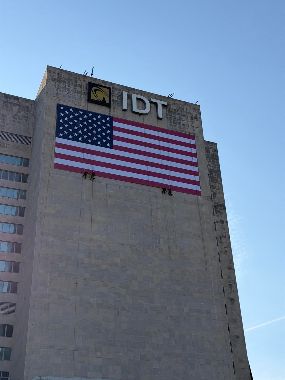 <span id="hs_cos_wrapper_name" class="hs_cos_wrapper hs_cos_wrapper_meta_field hs_cos_wrapper_type_text" style="" data-hs-cos-general-type="meta_field" data-hs-cos-type="text" >Large-Format American Flag Banner Installation on High-Rise Building</span>