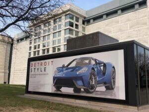 Car-poster-hung-on-window-300x225 Kickin' Glass and Taking Names! Lind BannerFrame Classic Has Your Retail Signage Covered!