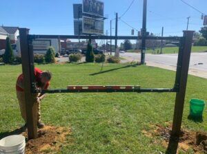 Lind-SignSpring-working-balancing-frame-and-post-in-the-ground-300x224 No Surface? No Problem! Lind Offers Free Standing Signage!