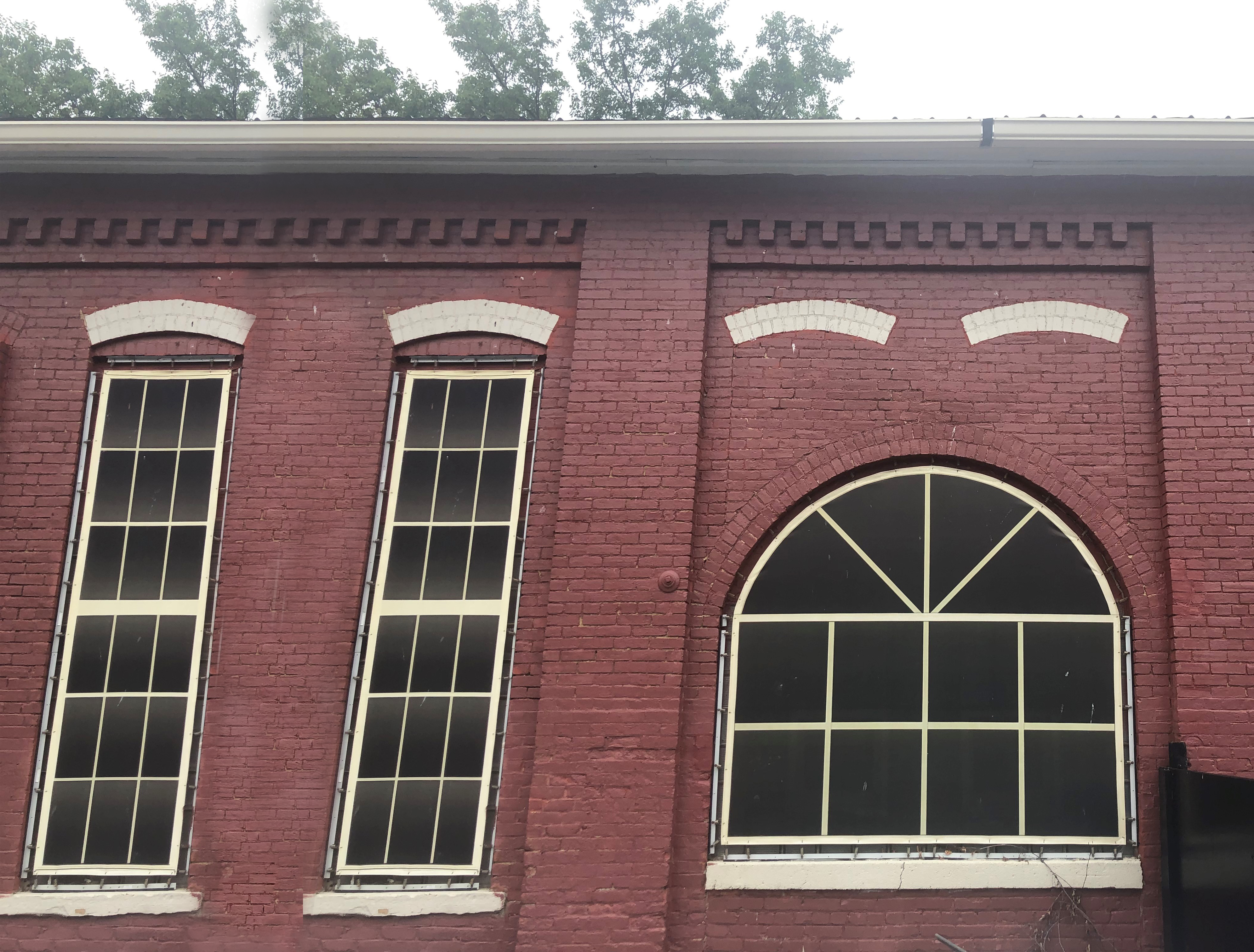 Round-Window Building Restoration: Lind SignSpring Banners Aren't Just For Marketing