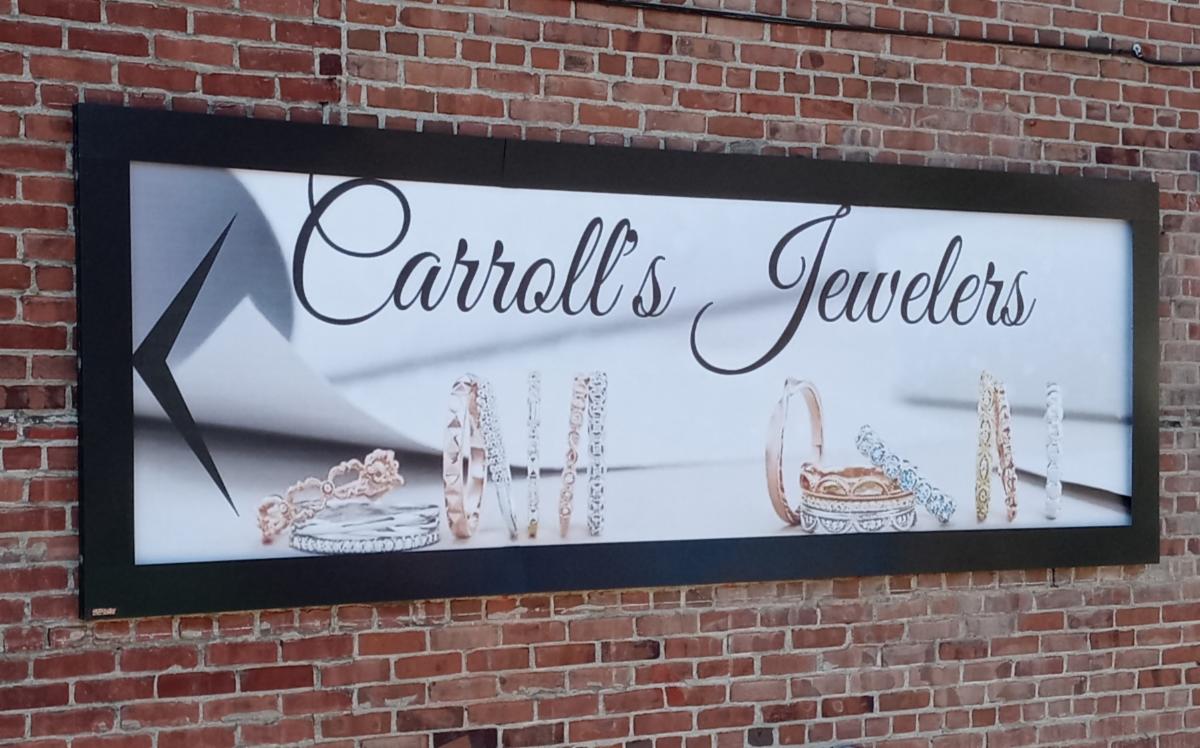 Carroll's Jewelers uses Lind SignSpring BannaerFrameHINGE for their wallscape