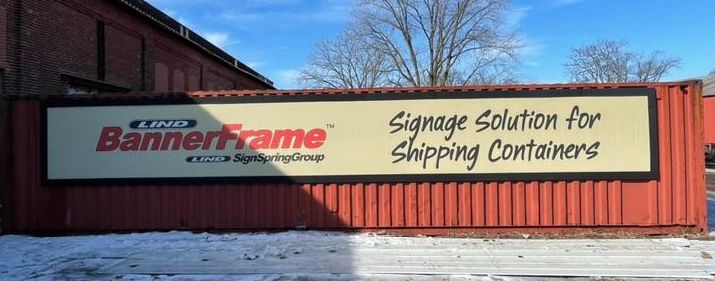 Lind_Sign_Spring_Banner_Frame_Shipping_Container Steel Siding Sign Challenges? Lind Offers Banner & Signage Solutions for Metal Siding!