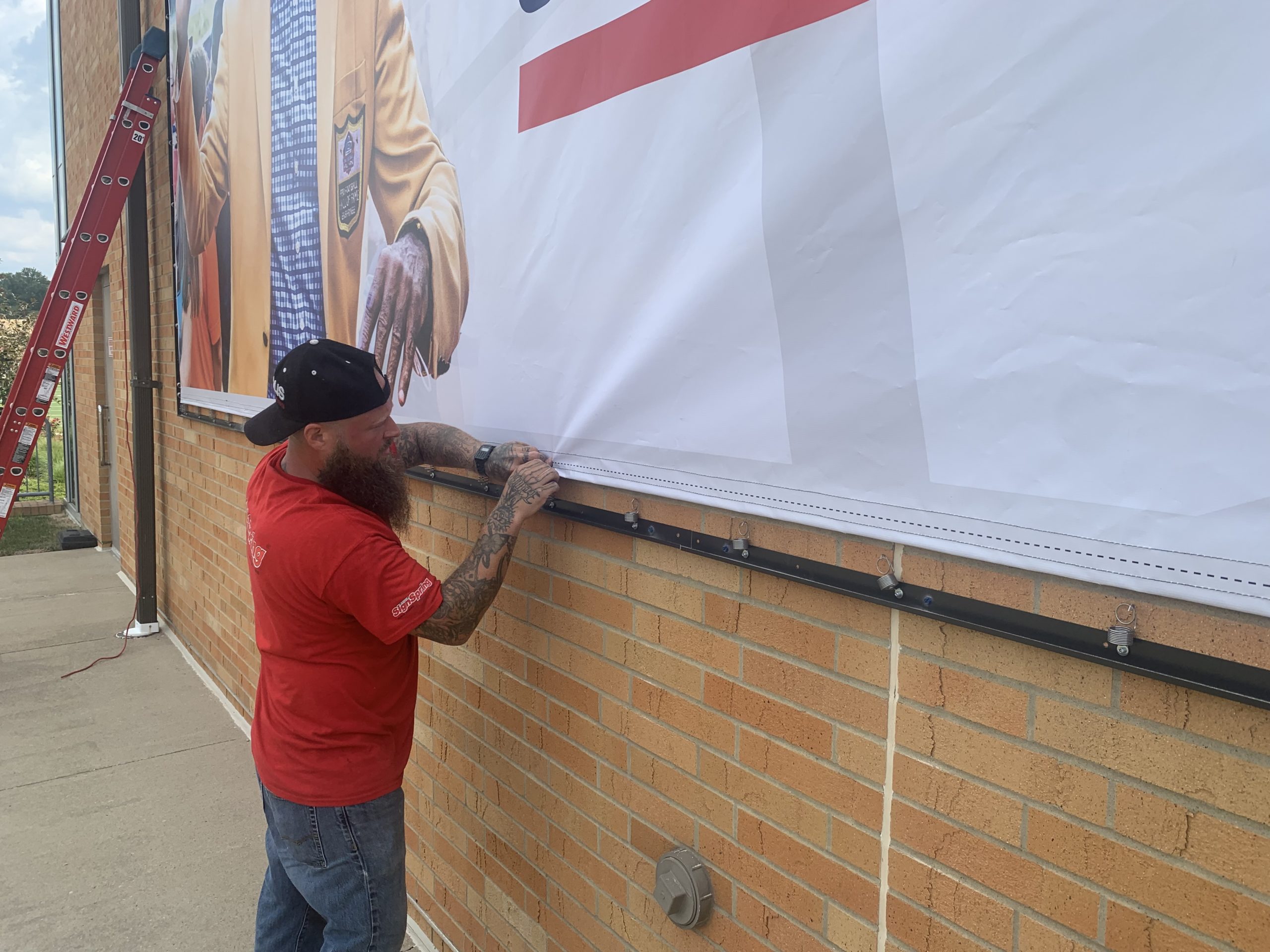 Canton-Pro-Football-Hall-Of-Fame-BannerFrame-Classic-Installation-brick-installing-springs-scaled Pro Football Hall-of-Fame Deserves the Best!