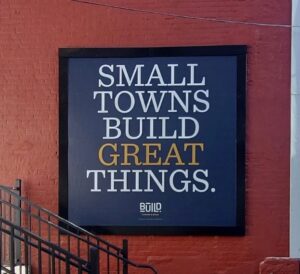 CoWork-Small-Towns-Great-Things-Lind-SignSpring-BannerFrame-Hinge-300x274 Gallery