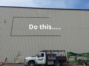 Banner-frame-being-hung-300x225 Steel Your Face! Banner Hanging Systems for Metal Siding!
