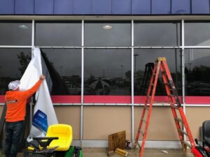 Blank-windows-preparing-for-poster-install-Copy-300x225 Kickin' Glass and Taking Names! Lind BannerFrame Classic Has Your Retail Signage Covered!